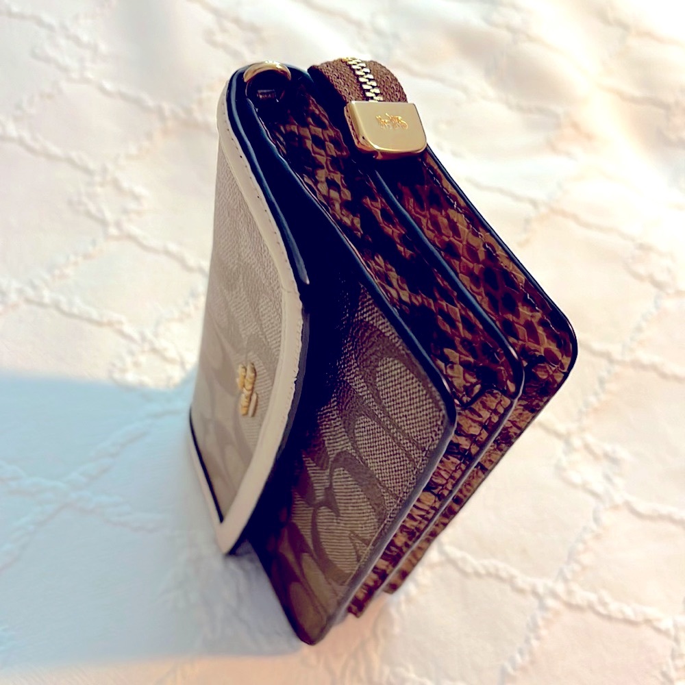 Authentic NWOT Coach clutch with snakeskin design detailing